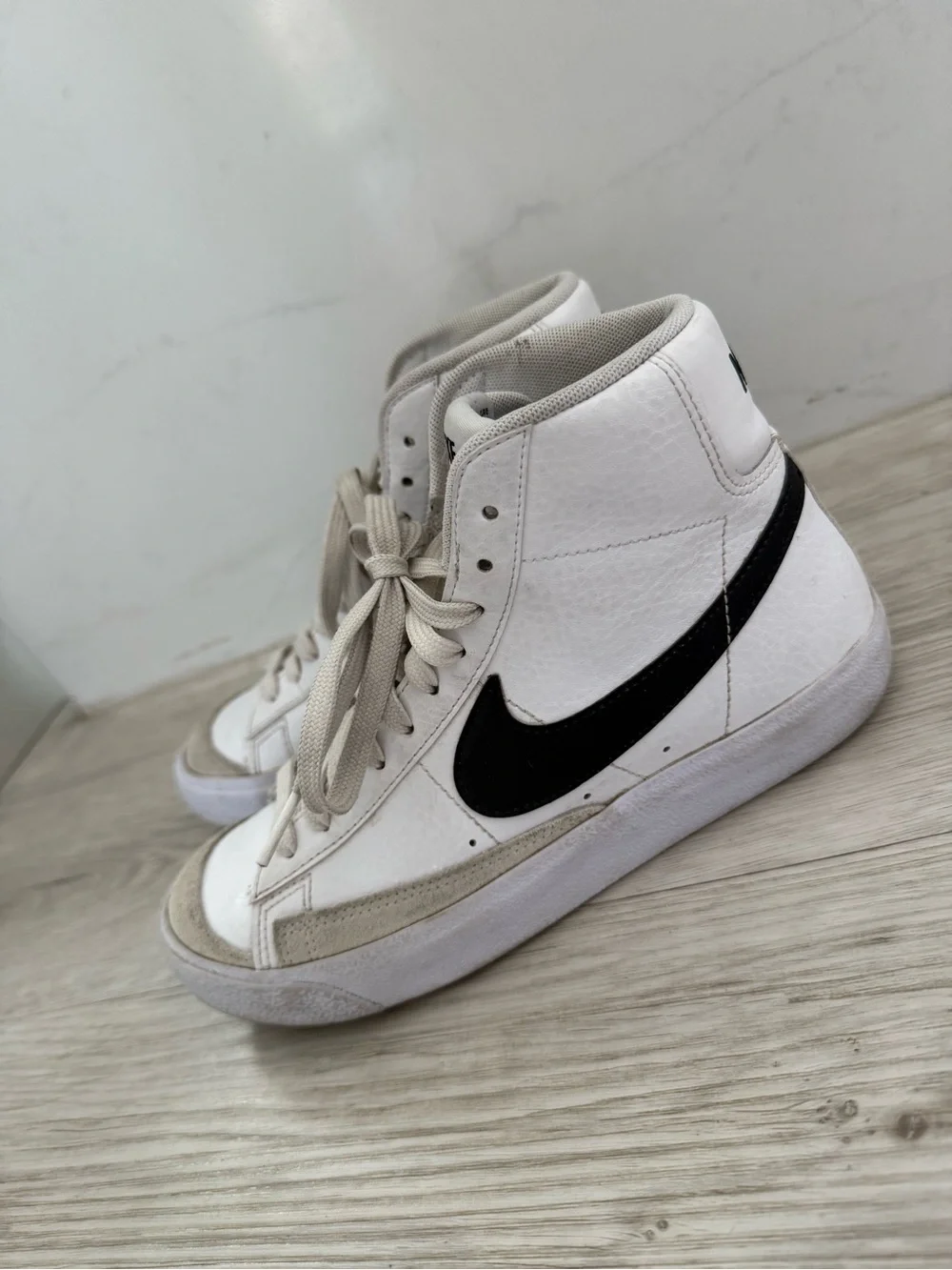 Nike Blazer Mid '77 White High-Top Sneakers with Black Swoosh